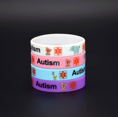 Autism medical alert awareness silicone wristbands in white, pink, blue and pink.