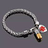 Cascade stainless steel customisable heart medical alert bracelet with pill shaped information holder charm.