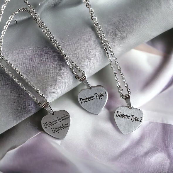 Diabetic Insulin Dependant, Diabetic Type 1 and Diabetic Type 2 medical alert heart pendant stainless steel necklaces with a silver backdrop