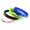 Kids Epilepsy medical alert and awareness silicone wristbands in blue, green, black and white.