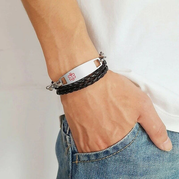 Customisable Havana slimline multi-layered leather and stainless steel medical alert bracelet worn on a male model in jeans and white top.
