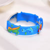 Kids Discovery silicone and stainless steel medical alert bracelet with a blue dinosaur theme.