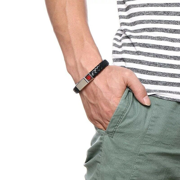 Lawnton leather medical alert bracelet with a silver tag, worn by a male model in a striped shirt.