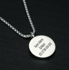 Lotus medical alert necklace showing personalised engraving on rear of coin pendant