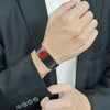 Black MARX II stainless steel medical alert bracelet on male model in a business suit