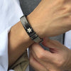 Milan stainless steel medical alert bracelet, silver strap with black engraved tag on a male model's arm