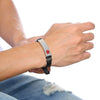 Black Milan stainless steel medical alert bracelet with a stainless steel tag worn by a male model.