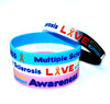 Multiple Sclerosis medical alert and awareness silicone wristbands in black, white, blue and pink colour-ways.