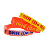 Brightly coloured yellow and orange DNR (Do Not Resuscitate) silicone wristbands