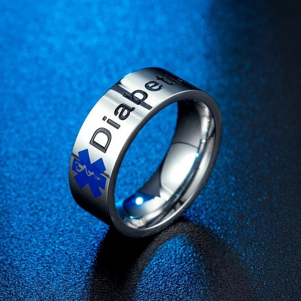 Silver stainless steel Diabetic medical alert ring, with blue Staff of Asclepius on a textured blue background