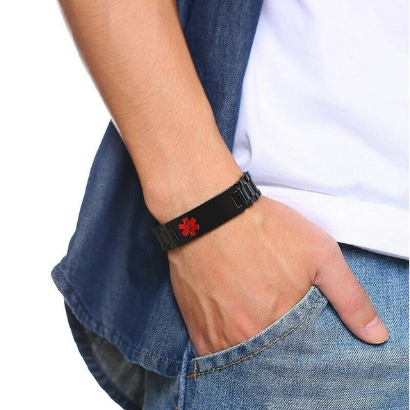 Titan black stainless steel medical alert bracelet worn by a male model in denim.