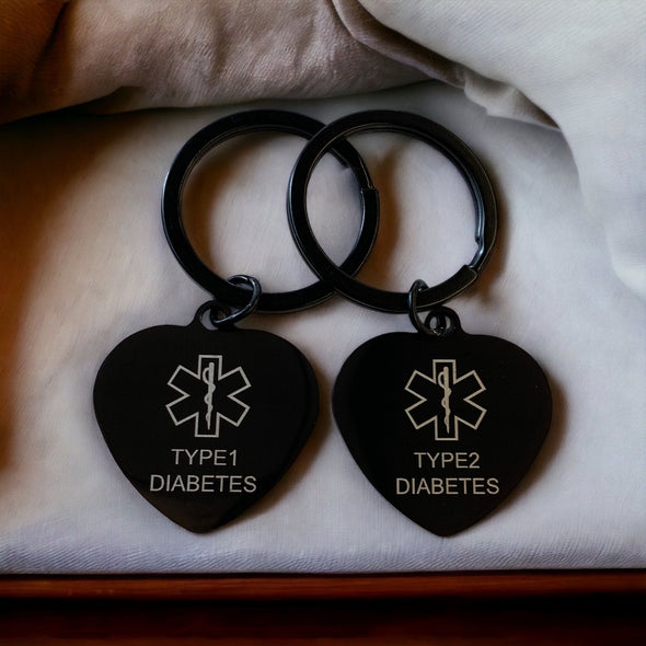Customisable Type 1 and Type 2 Diabetes black heart medical alert keyrings side by side.
