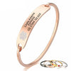 Valencia stainless steel medical alert bangle shown personalised and in various colours.