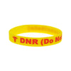 Brightly coloured yellow DNR (Do Not Resuscitate) silicone wristband